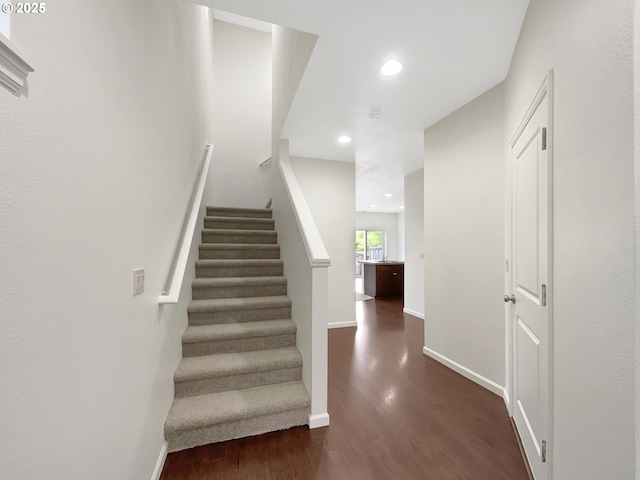 10095 NW Curtis St, North Plains, OR 97133 - staircase featuring wood finished floors, baseboards, and recessed lighting
