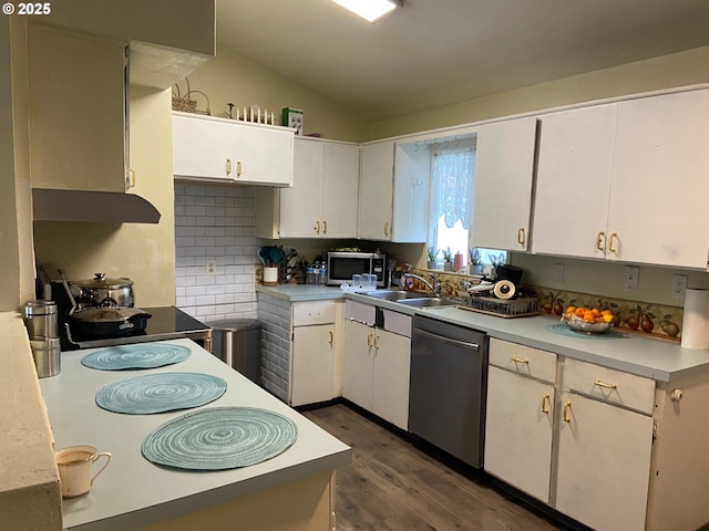 14407 SE Stephens St, Portland, OR 97233 - kitchen with stainless steel appliances, vaulted ceiling, dark wood-style flooring, light countertops, and white cabinetry