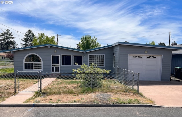 1214 NE Loper Ave, Prineville, OR 97754 - ranch-style home with an attached garage, a fenced front yard, concrete driveway, and a gate