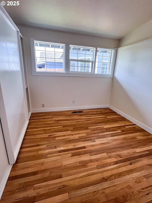 1214 NE Loper Ave, Prineville, OR 97754 - unfurnished room featuring wood finished floors and baseboards