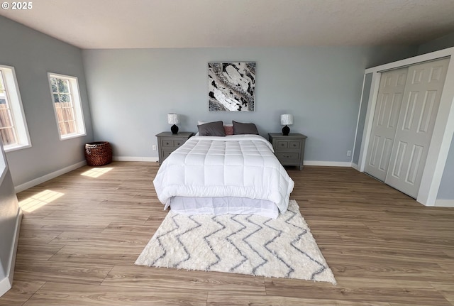 1214 NE Loper Ave, Prineville, OR 97754 - bedroom featuring light wood-type flooring, baseboards, and a closet