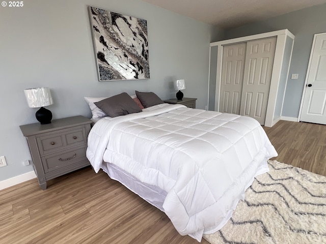 1214 NE Loper Ave, Prineville, OR 97754 - bedroom featuring wood finished floors, a closet, and baseboards
