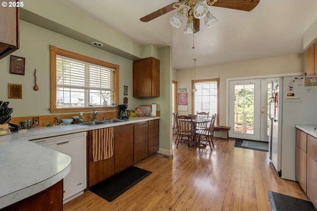 22885 S Tendril Ln, West Linn, OR 97068 - kitchen with white appliances, a sink, a ceiling fan, and plenty of natural light