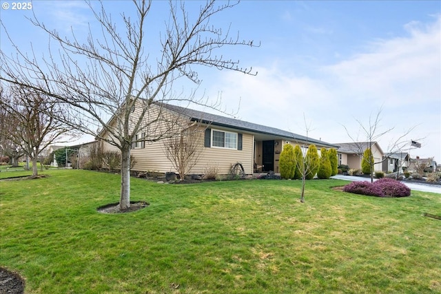 ranch-style house with a front lawn