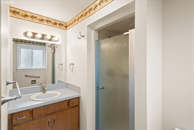 full bathroom featuring a stall shower and vanity