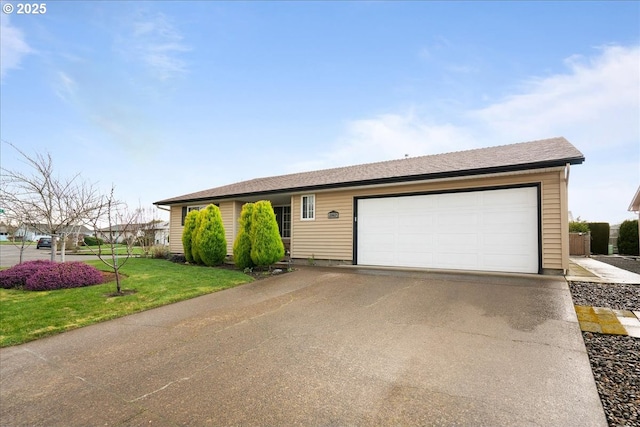 ranch-style home featuring an attached garage, aphalt driveway, and a front yard