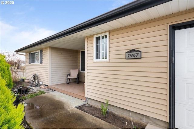 view of exterior entry with a garage