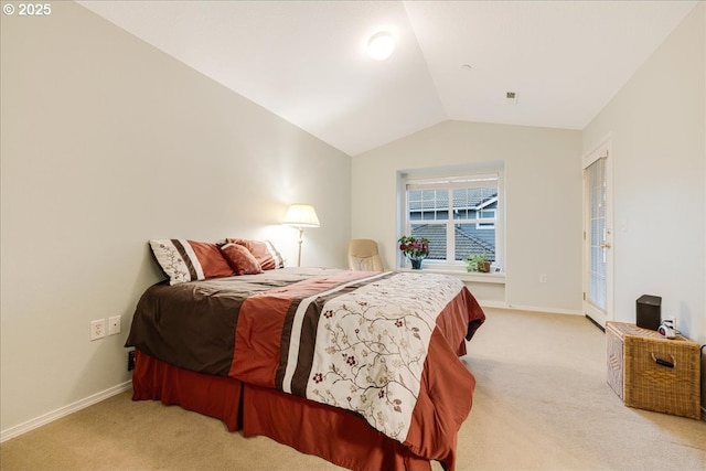 bedroom with baseboards, lofted ceiling, and light colored carpet