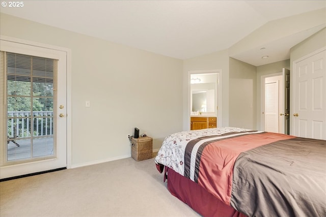 bedroom featuring light carpet, access to outside, connected bathroom, baseboards, and vaulted ceiling