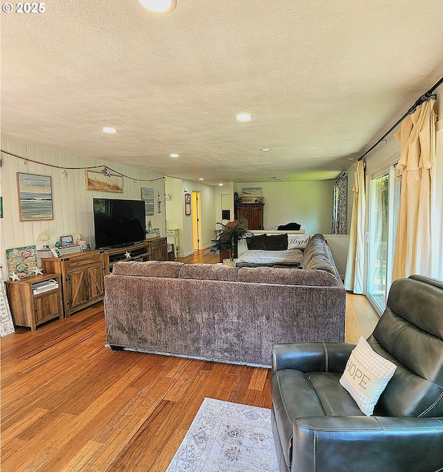 97640 Kadora Ln, North Bend, OR 97459 - living area with a textured ceiling, wood finished floors, and recessed lighting