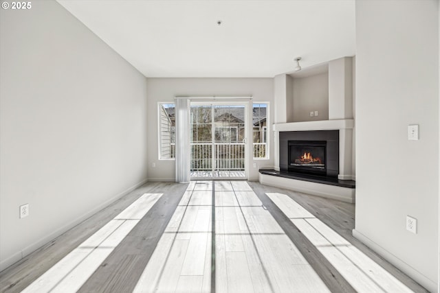 unfurnished living room with light hardwood / wood-style floors