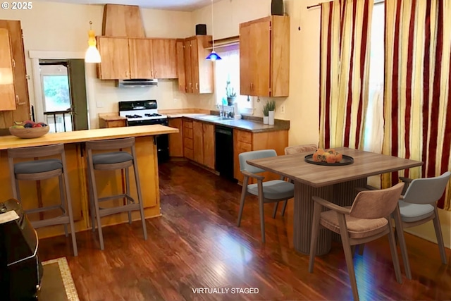 kitchen with dishwasher, a peninsula, dark wood-style floors, range with gas stovetop, and ventilation hood