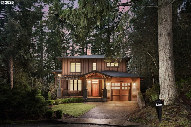 view of front of house with a garage and covered porch