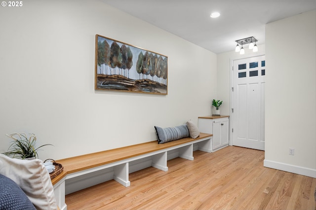 mudroom with light hardwood / wood-style flooring