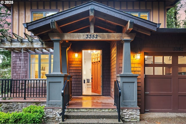 view of exterior entry featuring a garage