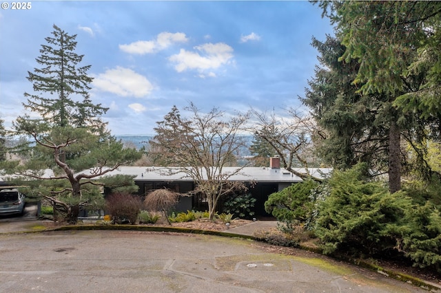 exterior space featuring a chimney