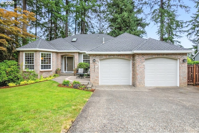 10585 SW 161st Ct, Beaverton, OR 97007 - view of front facade with an attached garage, asphalt driveway, brick siding, and a shingled roof