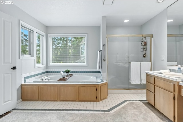 10585 SW 161st Ct, Beaverton, OR 97007 - bathroom featuring a stall shower, tile patterned floors, vanity, a garden tub, and recessed lighting