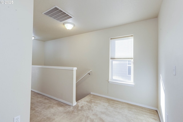 stairs featuring carpet and a wealth of natural light