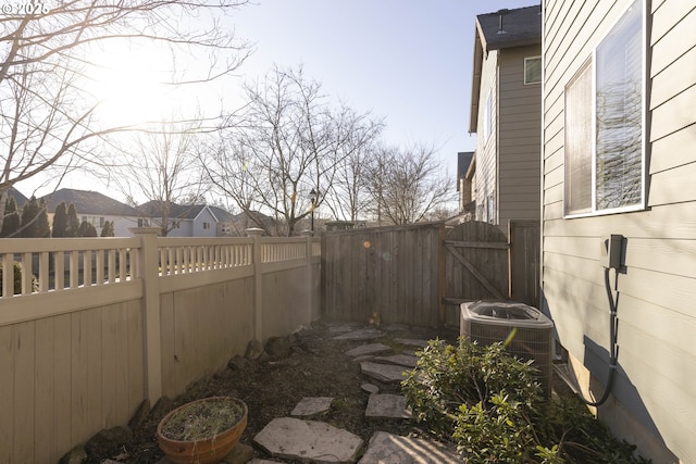 view of yard with central air condition unit