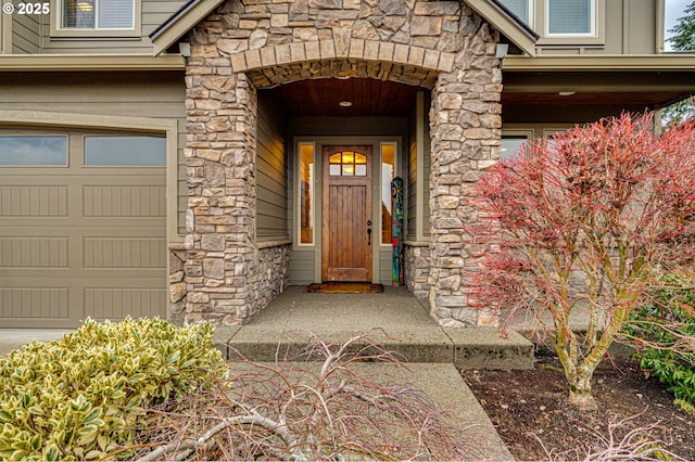 view of exterior entry featuring a garage