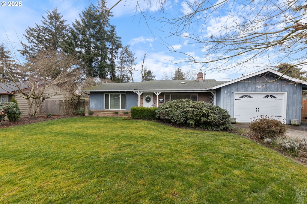 single story home with a front lawn and a garage