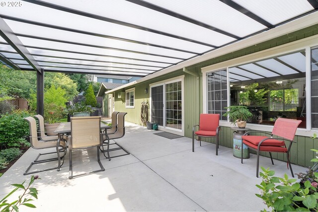 view of patio / terrace with outdoor dining space and a pergola
