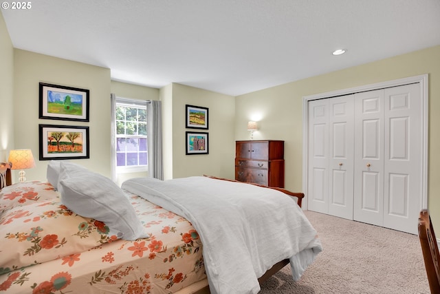 carpeted bedroom featuring a closet and recessed lighting