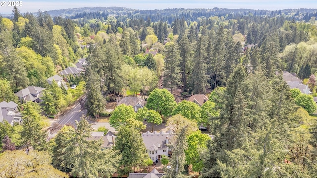 birds eye view of property featuring a residential view and a forest view