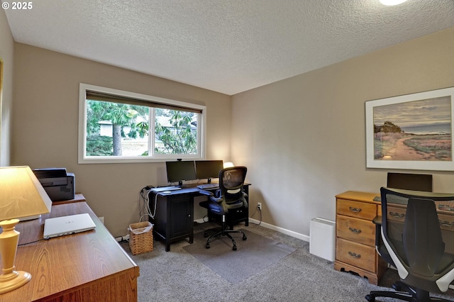 office with a textured ceiling, carpet flooring, and baseboards