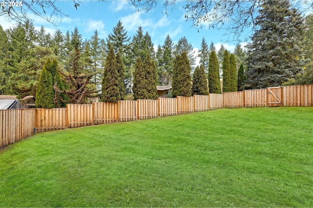 view of yard with a fenced backyard