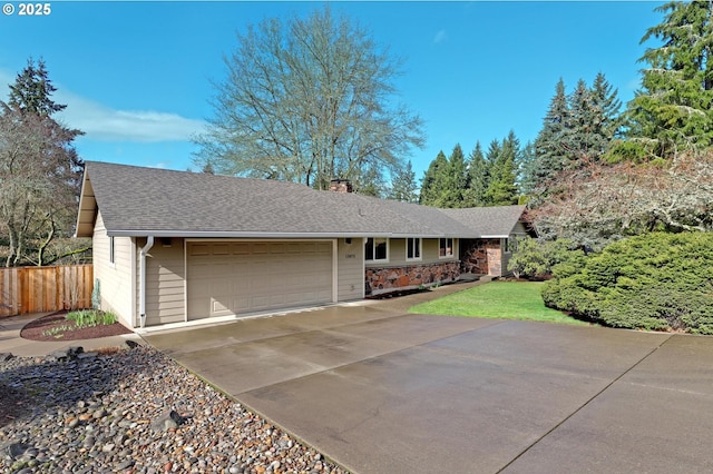 ranch-style house featuring a shingled roof, concrete driveway, a chimney, an attached garage, and fence