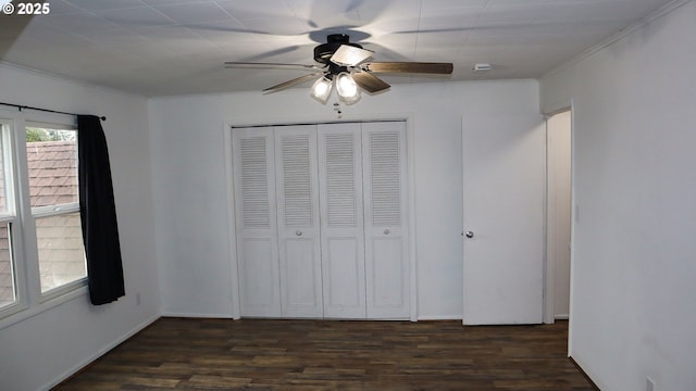 136 Morton Rd, Winlock, WA 98596 - unfurnished bedroom with ceiling fan, ornamental molding, wood finished floors, and a closet