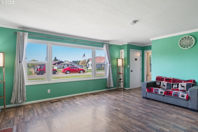 136 Morton Rd, Winlock, WA 98596 - living area with a textured ceiling, visible vents, wood finished floors, baseboards, and ornamental molding