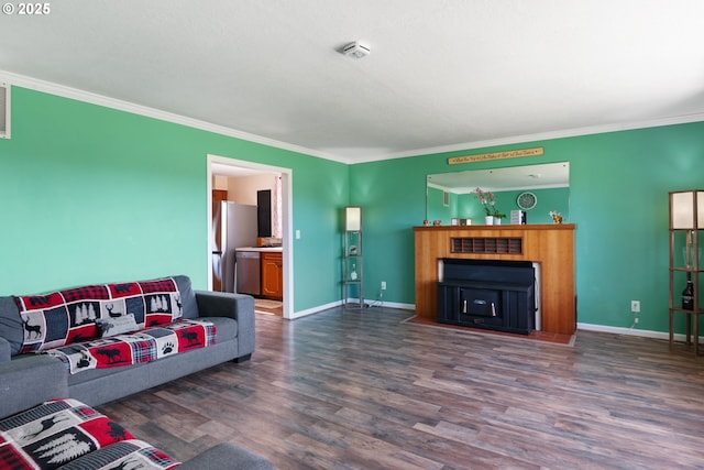136 Morton Rd, Winlock, WA 98596 - living room featuring baseboards, ornamental molding, and wood finished floors