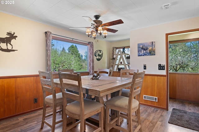 136 Morton Rd, Winlock, WA 98596 - dining space featuring a wainscoted wall, a wealth of natural light, wood walls, and visible vents
