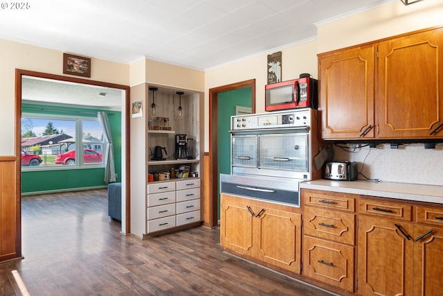 136 Morton Rd, Winlock, WA 98596 - kitchen with appliances with stainless steel finishes, ornamental molding, a warming drawer, and dark wood-type flooring