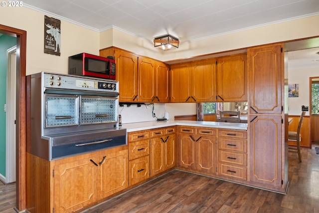 136 Morton Rd, Winlock, WA 98596 - kitchen with wall oven, dark wood-style floors, brown cabinetry, and a warming drawer