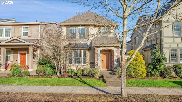 view of front of property with stone siding and a shingled roof