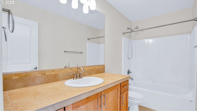 full bath with  shower combination, backsplash, vanity, and toilet