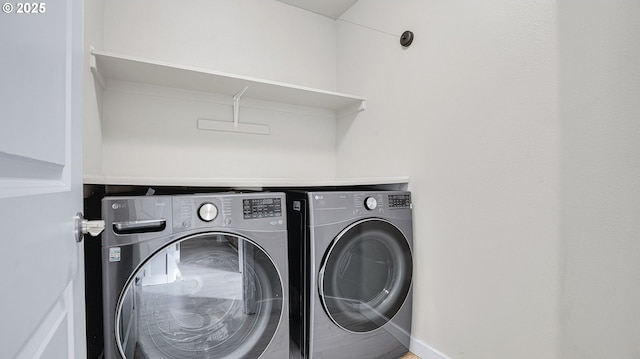 laundry area with laundry area and washing machine and clothes dryer