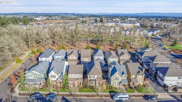 drone / aerial view featuring a mountain view and a residential view