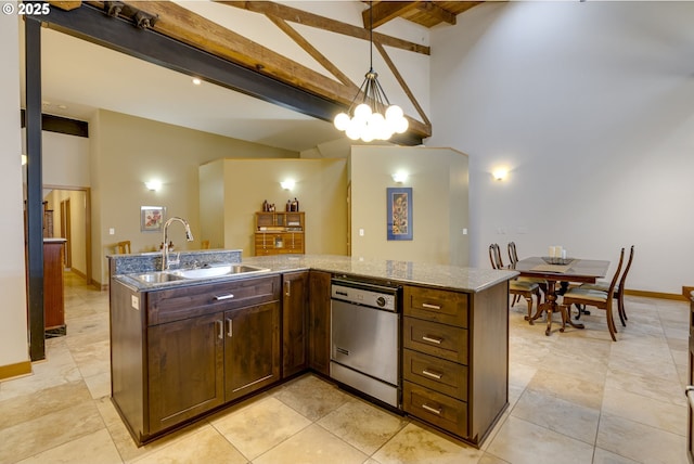 kitchen with beam ceiling, decorative light fixtures, stainless steel dishwasher, stone countertops, and a sink