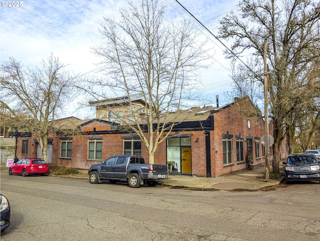 view of front of home featuring brick siding