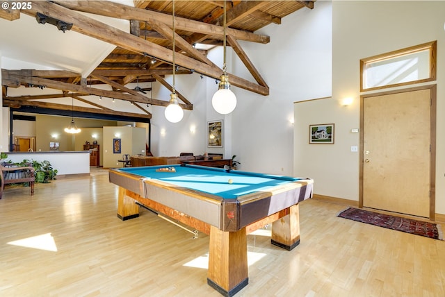 recreation room with baseboards, wood finished floors, pool table, high vaulted ceiling, and beam ceiling