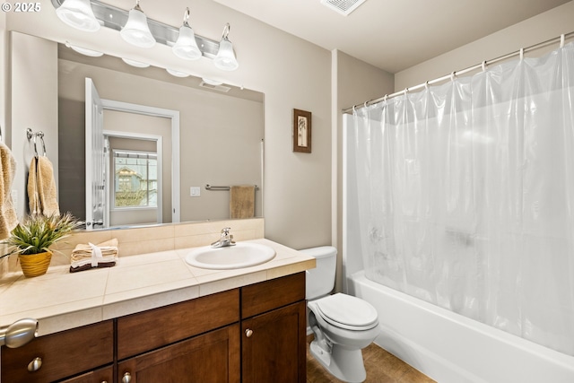bathroom with toilet, shower / bathtub combination with curtain, visible vents, and vanity
