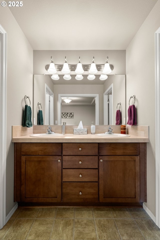 full bathroom featuring double vanity and a sink