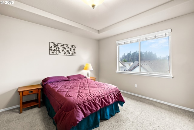 bedroom featuring carpet floors and baseboards