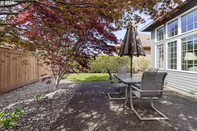 view of patio with fence private yard and outdoor dining space