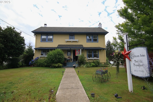 view of front of house with a front lawn